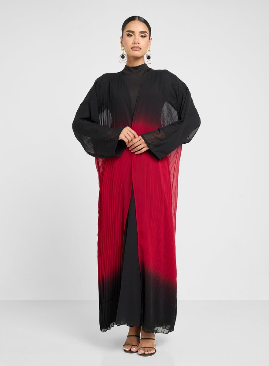 Model wearing a black and red ombre abaya